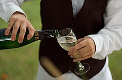 Waiter pouring Prosecco