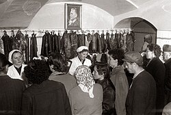 A butcher shop in Maribor adorned with a portrait of Tito, 1957