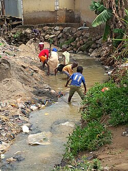 Children in Mpape community play in a waste water drainage area. This drainage was the suspected source of contamination of the well water that led to the cholera outbreak investigated by Nigeria FELTP residents in April 2014. Two samples collected from home wells around this drainage tested positive for Vibrio cholerae.