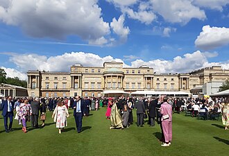 A garden party held outside the west façade of Buckingham Palace in 2024