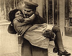 A young Svetlana Stalina being carried by her father in 1935