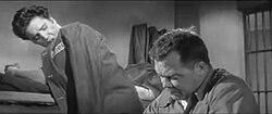 Elvis Presley as Vince Everett talks to Mickey Shaughnessy as Hunk Houghton in their cell.