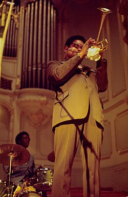 Gillespie performing at a Giants of Jazz concert in 1973 (behind him is drummer Art Blakey)