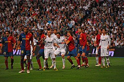 Abidal (far right) playing against Real Madrid.