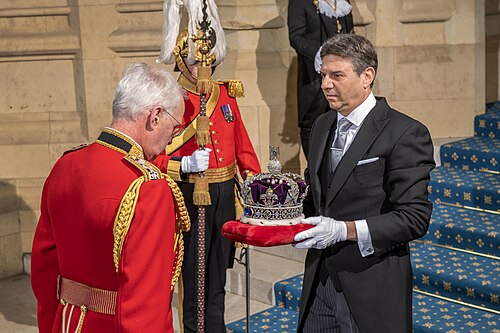 The Crown Jeweller (Mark Appleby) holding the Imperial State Crown at the 2022 State Opening of Parliament