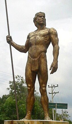 Sculpture of a native man standing at the entrance of Fusagasugá, Colombia, over the Highway 40.
