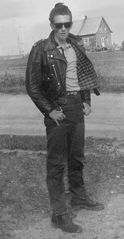 A man styling greaser fashion, 1960