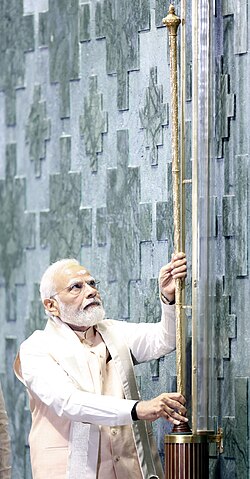 Indian prime minister Narendra Modi installing the Sengol sceptre in the new Indian Parliament