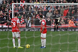 Fàbregas and Marouane Chamakh preparing to kick off in 2010. Fàbregas was a regular set-piece taker for Arsenal.