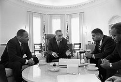 Johnson meeting with civil rights leaders Martin Luther King Jr. (left), Whitney Young, and James Farmer in the Oval Office on January 18, 1964