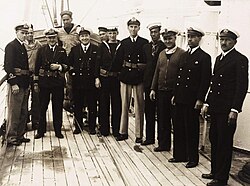 Members of the ship's company of HMS Castle Harbour, assigned to the Royal Naval Dockyard as the Examination Service vessel (that inspected merchant ships). Crew members included seafarers from the Merchant Navy. HMS Castle Harbour would later be sunk by a German submarine while being delivered to the Mediterranean by a Merchant Navy crew
