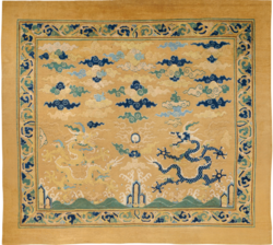 An imperial throne carpet with double dragon and seed pearl motif, 16th century