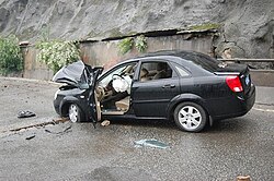 Falling debris, such as the object that landed on this vehicle, hindered rescue workers' progress as they attempted to cross the mountain.