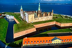 Kronborg Castle in the town of Helsingør. Immortalized as Elsinore in William Shakespeare's play Hamlet, Kronborg is one of the most important Renaissance castles in Northern Europe and was inscribed on the UNESCO World Heritage list in Northern Europe in 2000.