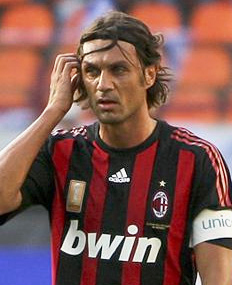 A man a red and black striped top.