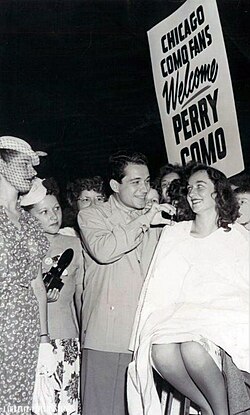 Arriving in Chicago for shows in 1947, Como is met by his fans who get a hair trim along with a song.