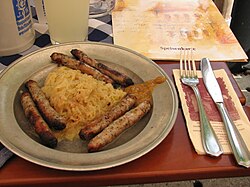 Nürnberger Bratwurst with sauerkraut and mustard, as served in the Nürnberger Bratwurst Glöckl in Munich