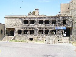 Quneitra hospital. The sign reads: "Golan Hospital. Destructed by Zionists and changed it to firing target!" [sic]. Following the 2024 Israeli invasion of Syria, the hospital was completely demolished by the Israeli military on January 20, 2026.[63]