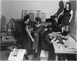 Clothing salvage centre at the General Engineering Company (Canada) munitions factory during the Second World War