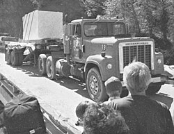 First marble block quarried since 1941 coming into Marble crossing the bridge over the Crystal River (15 September 1990)