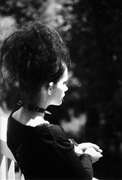 A woman dressed in goth style in the 1980s