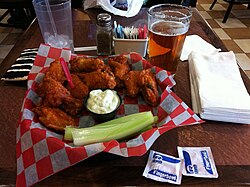 Buffalo wings, invented in Buffalo, New York, are chicken wings that are generally deep-fried then coated or dipped in a sauce. They are now a staple in the cuisine of the United States.