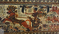 Tutankhamun charging enemies on his chariot, 18th dynasty