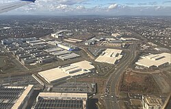 An aerial view of data centers intermingled with other commercial buildings in Loudoun County, near Ashburn