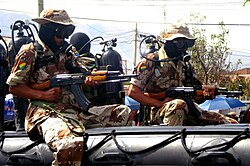 Scuba-equipped Bolivian marines aboard an inflatable boat