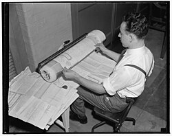 1939 photo of a worker at the archives preserving government documents