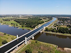 A bridge carrying canal with water, passing over a valley