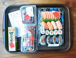 Sushi in shops are usually sold in plastic trays.