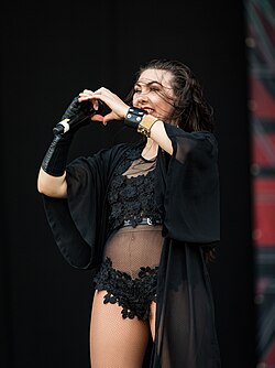 Elize Ryd making a heart sign at a concert in 2018
