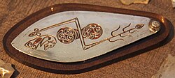 Silver plaque from the Norrie's Law hoard, Fife, with double disc and Z-rod symbol