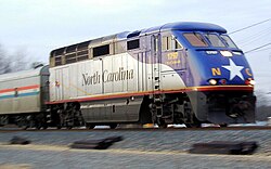 Amtrak's Piedmont near Charlotte, North Carolina, with a state-owned locomotive. This route is run under a partnership with the North Carolina Department of Transportation, 2003.