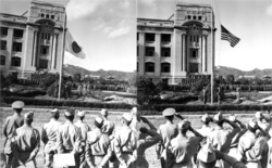 Japanese flag being taken down and replaced with the flag of the United States at the Japanese General Government Building, Seoul on 9 September 1945