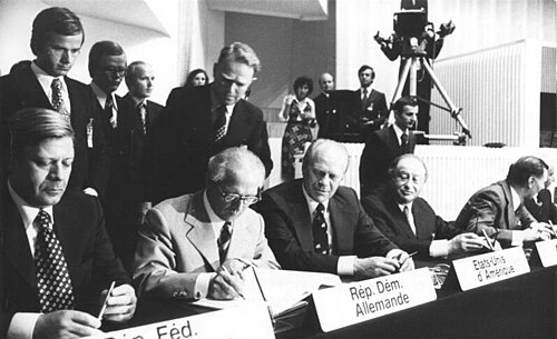 Chancellor of the Federal Republic of Germany (West Germany) Helmut Schmidt, Chairman of the State Council of the German Democratic Republic (East Germany) Erich Honecker, U.S. president Gerald Ford and Austrian chancellor Bruno Kreisky signing the Helsinki Act