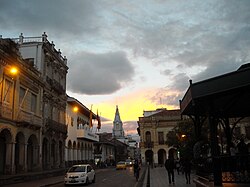 Street view of Simón Bolívar Street, named after Simón Bolívar, next to Calderón Park, in the Historical Center.