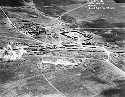 Aerial photograph of air raid on Afulah railway on 19 September 1918. Road to Nazareth in top left corner