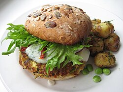 A vegetarian hamburger with roast potatoes