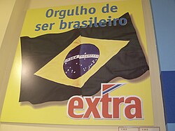 Nationalistic advertisement from the Extra supermarket in Fortaleza, Brazil. The sign reads "Proud to be Brazilian".