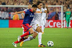 Mbabu and Georgi Shchennikov clashing over a ball during a BSC Young Boys and CSKA Moscow match on 15 August 2017.