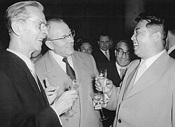 Kim on a 1956 visit to East Germany, chatting with painter Otto Nagel and Prime Minister Otto Grotewohl