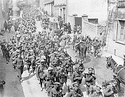 French and British troops marching back through Passy-sur-Marne, 29 May 1918.