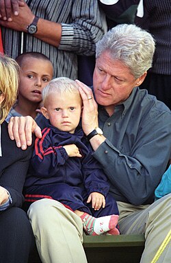 US President Bill Clinton with Albanian children during his visit to Kosovo, June 1999