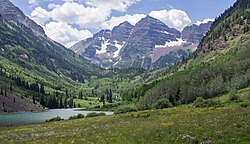 Maroon Bells, at 14,163 ft (4,317 m), is part of White River National Forest and a tourist destination