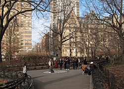Wintertime at Strawberry Fields in Central Park with the Dakota in the background