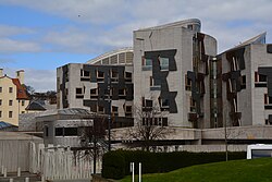 The unique architecture of the Scottish Parliament was complicated by design changes and cost increases.