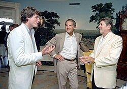 Reeve with Frank Gifford and President Ronald Reagan at a reception and picnic marking the 15th anniversary of the Special Olympics program in the Diplomatic Reception room of the White House, June 1983
