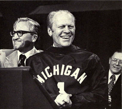 U.S. President Gerald Ford, BA '35, wearing a "Michigan #1" sweater during the kick-off of Ford's 1976 presidential campaign at the University of Michigan's campus in Ann Arbor